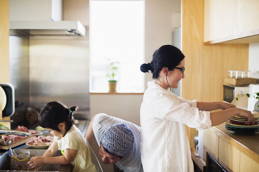 Family preparing a barbecue ingredients.